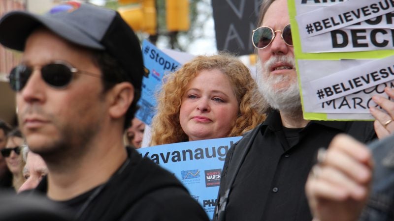 About 200 protesters gather outside the United States Custom House at 200 Chestnut Street to voice their objections to Brett Kavanaugh as a nominee for the U.S. Supreme Court in light of sexual assault allegations. (Emma Lee/WHYY)