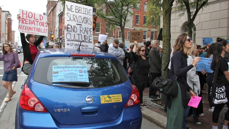 About 200 protesters gather outside the United States Custom House at 200 Chestnut Street to voice their objections to Brett Kavanaugh as a nominee for the U.S. Supreme Court in light of sexual assault allegations. (Emma Lee/WHYY)