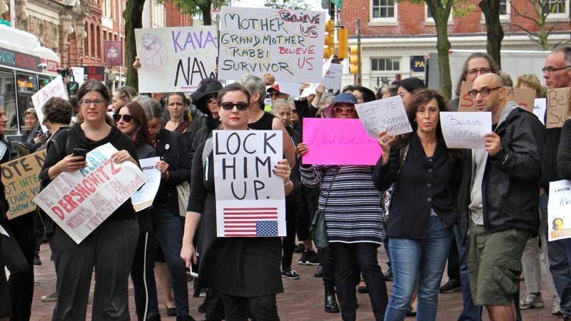 About 200 protesters gather outside the United States Custom House at 200 Chestnut Street to voice their objections to Brett Kavanaugh as a nominee for the U.S. Supreme Court in light of sexual assault allegations. (Emma Lee/WHYY)