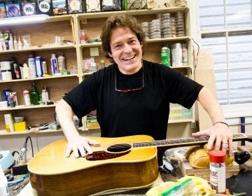 Tim Huenke is a restorative luthier and owner of Superior Guitar Works in Flourtown. (Kimberly Paynter/WHYY)