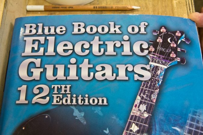 A guitar that Tim Huenke built with a biology teacher was pictured on the cover of the 12th edition of 