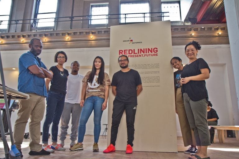 The Little Giant Creative Team during the setup of the Dream Deferred exhibit at 6th and Spring Garden Streets in Philadelphia. (Kimberly Paynter/WHYY)