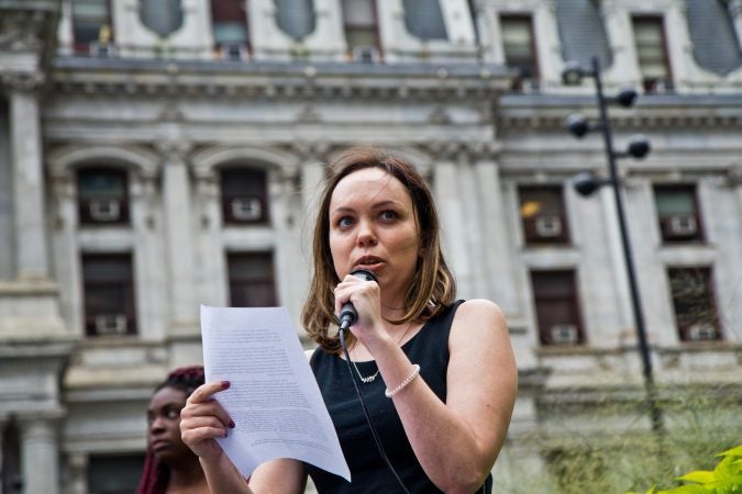 Emily Woods shares her experiences with rape and sexual assault as part of a national walkout to show support for Christine Blasey Ford and Deborah Ramirez, two women who claim Supreme Court Judge nominee Brett Kavanaugh assaulted them. (Kimberly Paynter/WHYY)