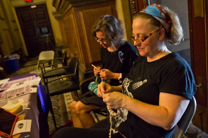 Samantha Osmer, (right), and Marcie Merz, (left) traveled into Philadelphia from Bucks Coutny to participate in the annual Knit In. (Kimberly Paynter/WHYY)