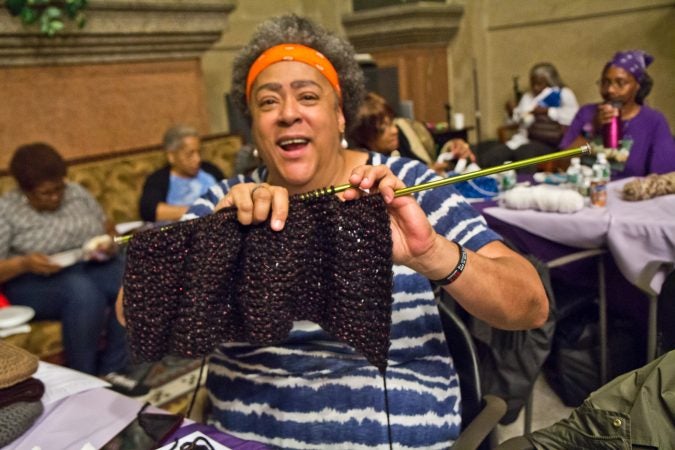 Julia Kent knits a prayer shawl at the annual Knit In. She often knits with other women at 62nd and Cedar in West Philadelphia called the Sunshine Group. (Kimberly Paynter/WHYY)