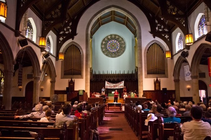 Members of the First United Methodist Church of Germantown’s congregation gather to support the Reyes and Thompson families. (Kimberly Paynter/WHYY)