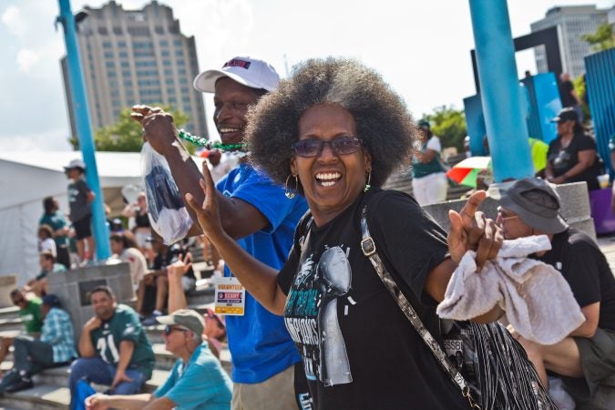 Shrila Smith, an Eagles fan and Brewerytown resident, dances when the Eagles win Super Bowl VII during a replay at Penn’s Landing. (Kimberly Paynter/WHYY)