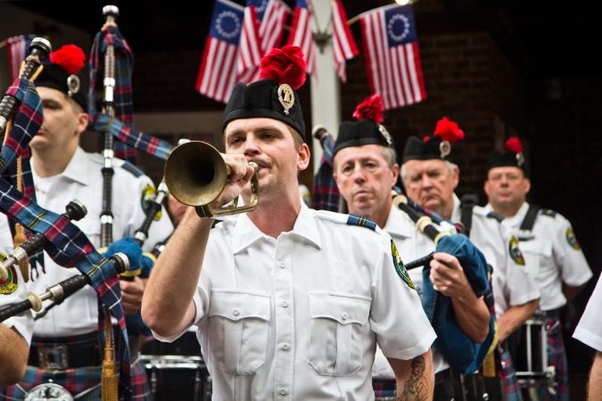 aps is played at the end of the memorial ceremony. (Kimberly Paynter/WHYY)