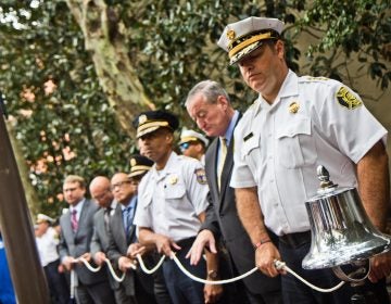 City officials ring the bell in honor of those who lost their lives on September 11, 2001, and the first responders. (Kimberly Paynter/WHYY)