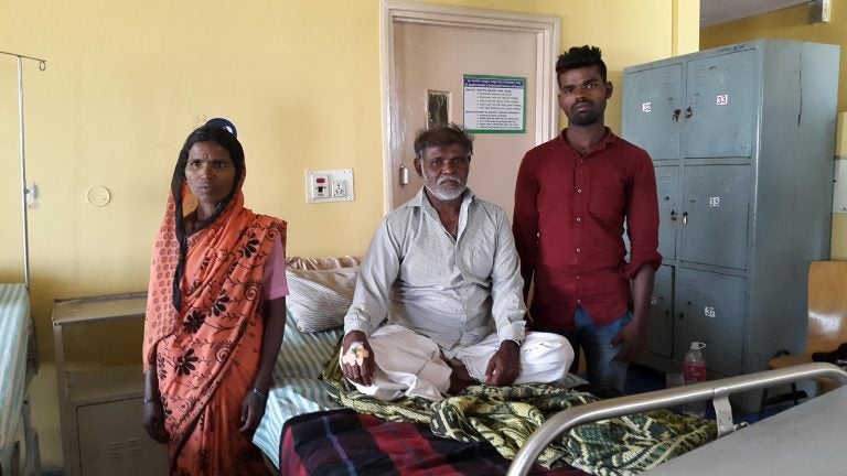 Sidlappa, who goes by one name, is 58 years old and waiting to get an angiogram. He traveled 8 hours to the hospital in Bangalore with his wife Ramlingamma and two of his seven children. (Mary-Rose Abraham)