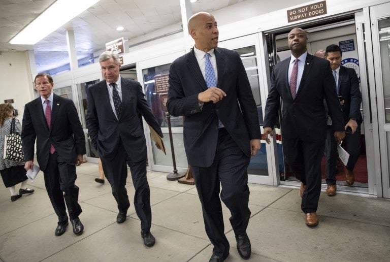 (From left), Sen. Richard Blumenthal, D-Conn., Sen. Sheldon Whitehouse, D-R.I., Sen. Cory Booker, D-N.J., and Sen. Tim Scott, R-S.C., arrive at the Capitol for a procedural vote on an appropriations measure, in Washington, Thursday, Aug. 23, 2018. (J. Scott Applewhite/AP Photo)