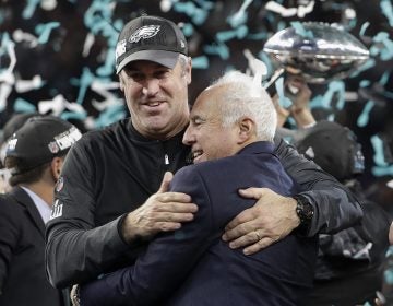 FILE - In this Feb. 4, 2018, file photo, Philadelphia Eagles owner Jeffrey Lurie, right, and head coach Doug Pederson celebrate after the NFL Super Bowl 52 football game against the New England Patriots, in Minneapolis. Before the Eagles begin their quest for a repeat, they'll have one more celebration when the first Super Bowl banner in franchise history is unveiled in front of a sellout crowd that waited forever to witness the moment. 