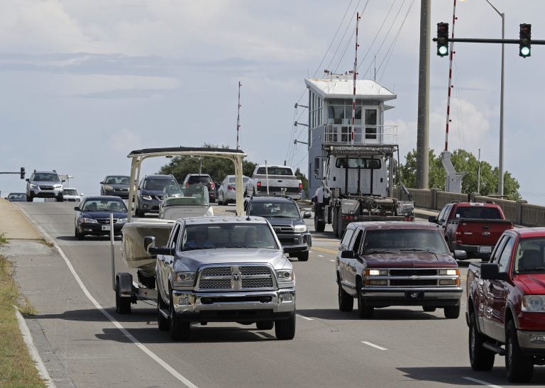 People drive over a drawbridge in Wrightsville Beach, N.C., as they evacuate the area in advance of Hurricane Florence, Tuesday, Sept. 11, 2018. Florence exploded into a potentially catastrophic hurricane Monday as it closed in on North and South Carolina, carrying winds up to 140 mph (220 kph) and water that could wreak havoc over a wide stretch of the eastern United States later this week. (AP Photo/Chuck Burton)