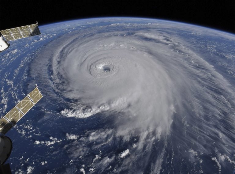 This image provided by NASA shows Hurricane Florence from the International Space Station on Wednesday, Sept. 12, 2018, as it threatens the U.S. East Coast. Hurricane Florence is coming closer and getting stronger on a path to squat over North and South Carolina for days, surging over the coast, dumping feet of water deep inland and causing floods from the sea to the Appalachian Mountains and back again.  (NASA via AP)