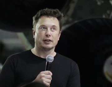 In this Monday, Sept. 17, 2018, file photo Tesla CEO and SpaceX founder and chief executive Elon Musk speaks after announcing Japanese billionaire Yusaku Maezawa as the first private passenger on a trip around the moon in Hawthorne, Calif. Tesla Inc. has turned over documents to the U.S. Justice Department after statements by Musk about taking the company private, the electric car maker confirmed Tuesday, Sept. 18. (Chris Carlson/AP Photo, File)