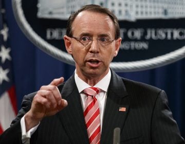 In this July 13, 2018, file photo, Deputy Attorney General Rod Rosenstein speaks during a news conference at the Department of Justice in Washington. Rosenstein is denying a report in The New York Times that he suggested last year that he secretly record President Donald Trump in the White House to expose the chaos in the administration. Rosenstein says the story is “inaccurate and factually incorrect.” (Evan Vucci/AP Photo, File)