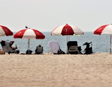 Beach goers taking in the sun. (Bill Barlow/for WHYY)