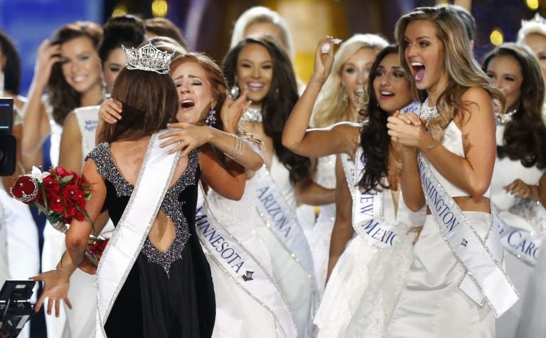 Miss North Dakota Cara Mund is congratulated by contestants after being named Miss America during Miss America 2018 pageant, Sunday, Sept. 10, 2017, in Atlantic City, N.J.