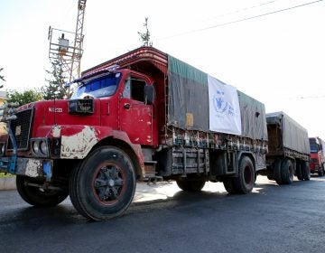 A World Food Programme convoy carries humanitarian aid to Aleppo, Syria. Getting food into conflict zones is a major hurdle — and a topic of discussion at the WFP's Innovation Accelerator. (Cem Genco/Anadolu Agency/Getty Images)