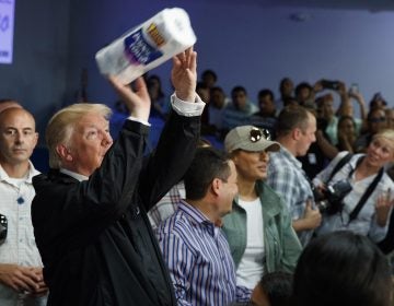 President Trump tosses paper towels into a crowd in Puerto Rico after Hurricane Maria hit the island in 2017.
(Evan Vucci/AP)