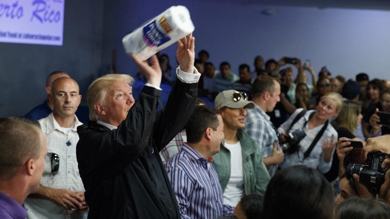 President Trump tosses paper towels into a crowd in Puerto Rico after Hurricane Maria hit the island in 2017.
(Evan Vucci/AP)
