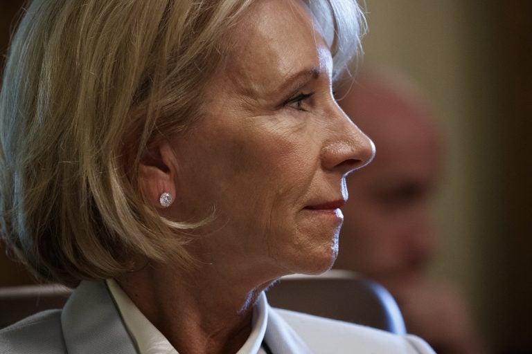 Secretary of Education Betsy DeVos listens as President Donald Trump speaks during a June 21 cabinet meeting at the White House in Washington.
(Evan Vucci/AP)