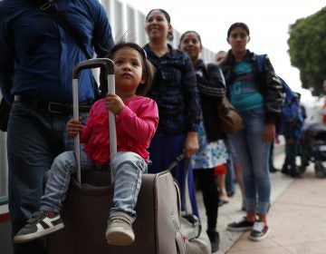 Asylum seekers line up at the San Ysidro port of entry in Tijuana, Mexico. The ACLU announced today a preliminary agreement with the Trump administration to allow some parents already in the U.S. but separated from their children at the border to apply for asylum.
(Gregory Bull/AP)