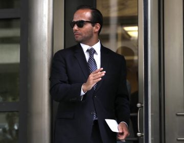 Former Trump campaign aide George Papadopoulos, whose actions triggered the Russia investigation, leaves federal court after he was sentenced to 14 days in prison on Friday. He had pleaded guilty to lying to the FBI. (Jacquelyn Martin/AP)