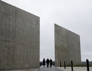 President Trump walks with Melania Trump and National Parks and National Parks superintendent Stephen Clark through the Flight 93 National Memorial in Shanksville, Pa., on Tuesday.