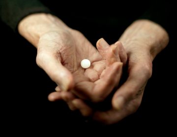 Daily low-dose aspirin can be of help to older people with an elevated risk for a heart attack. But for healthy older people, the risk outweighs the benefit. (Bruno Ehrs/Getty Images)