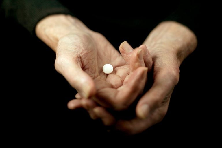 Daily low-dose aspirin can be of help to older people with an elevated risk for a heart attack. But for healthy older people, the risk outweighs the benefit. (Bruno Ehrs/Getty Images)