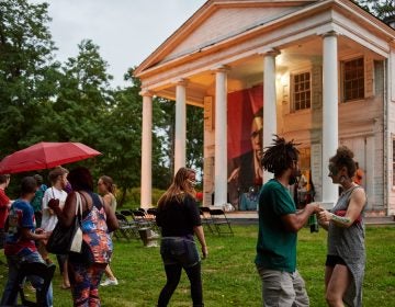 Strawberry Mansion residents mingle on the lawn of the Hatfield House at an art and storytelling event hosted by Amber Art and Design in July. (Albert Yee for Fairmount Park Conservancy)