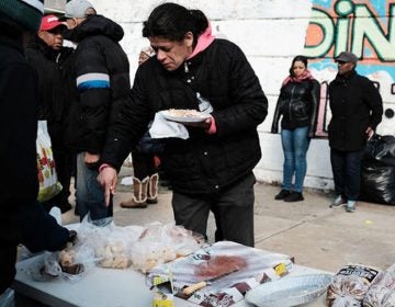 A local church distributes food and clothes to residents in need in the Kensington section in Philadelphia. (Spencer Platt/Getty Images)