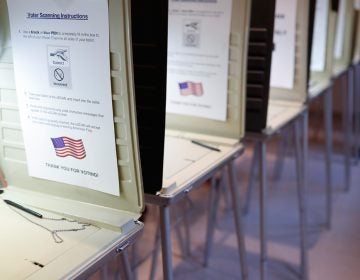 A row of empty booths at a polling station in the Terrace Park Community Building on Election Day in Cincinnati. (AP Photo/John Minchillo, File)