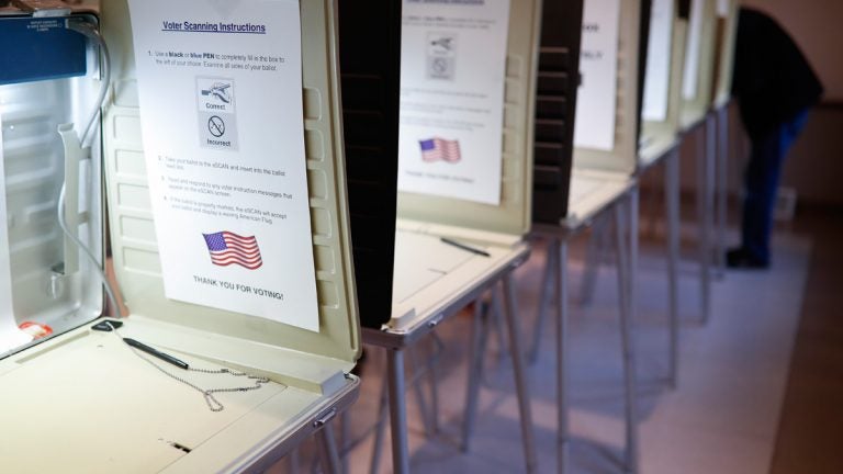 A row of empty booths at a polling station in the Terrace Park Community Building on Election Day in Cincinnati. (AP Photo/John Minchillo, File)