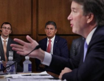 Sen. Joe Manchin, D-W.Va., listens to Supreme Court nominee Judge Brett Kavanaugh as he testifies before the Senate Judiciary Committee on Sept. 6. Running a tight reelection race in a conservative state, Manchin has faced pressure to support Kavanaugh.