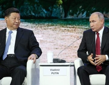 The U.S. is sanctioning China's military for buying equipment from Russia that included fighter jets and surface-to-air missiles. Russian President Vladimir Putin (right) is show with Chinese President Xi Jinping, in Russia earlier this month. (Bloomberg/Bloomberg via Getty Images)