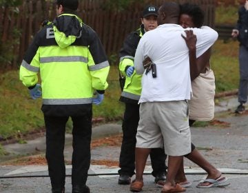 A woman reacts after a large tree fell on a house in Wilmington, N.C., as Hurricane Florence hit the area Friday. One man was taken out of the home in critical condition. (Mark Wilson/Getty Images)