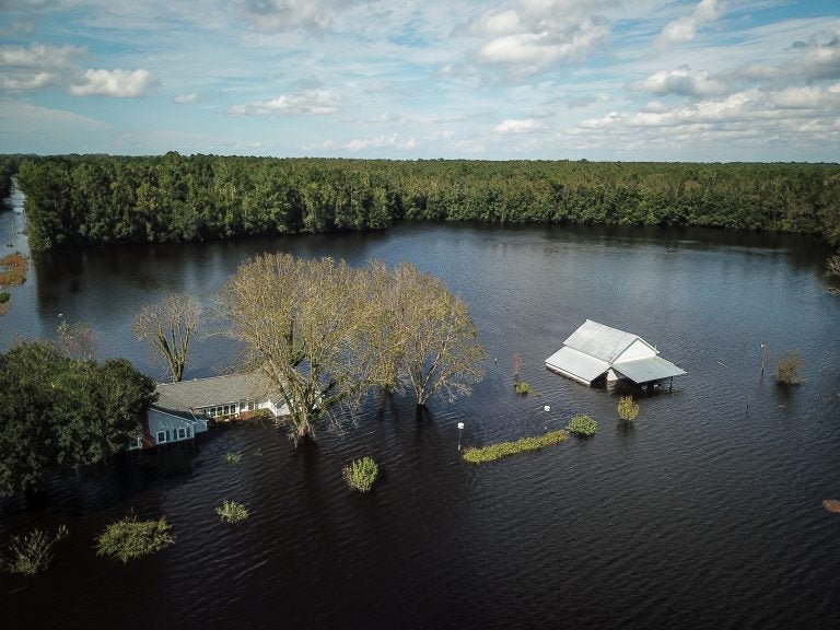 A flooded farm stands next to the Lumber River on Monday in this aerial photograph taken after Hurricane Florence hit Lumberton, N.C. (Charles Mostoller/Bloomberg /Bloomberg via Getty Images)