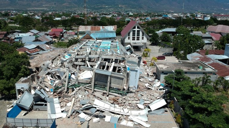 This aerial picture shows the remains of a 10-story hotel in Palu in Indonesia's Central Sulawesi on Sunday. (Azwar/AFP/Getty Images)
