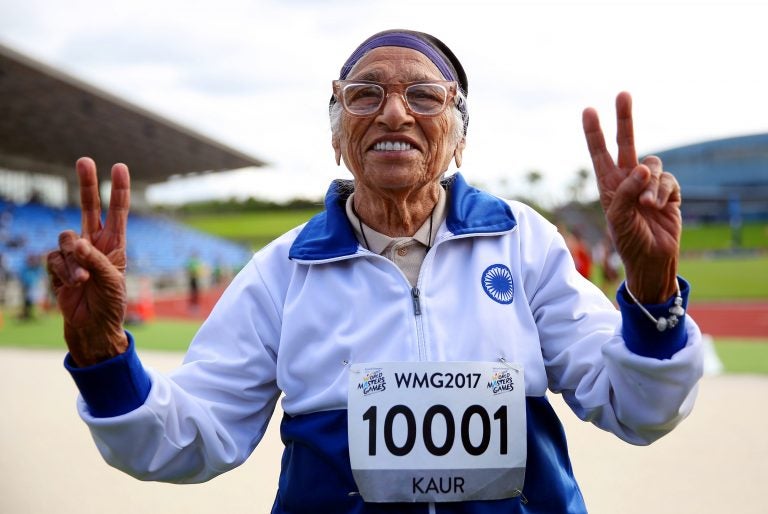 Man Kaur of India celebrates after competing in the 100-meter sprint in the 100+ age category at the World Masters Games in Auckland, New Zealand, in April 2017. (Michael Bradley/AFP/Getty Images)
