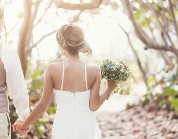 Shifts in temperature are leading to shifts in the wedding industry as bakers, photographers, florists and the couples they serve think about how to beat the heat on this all-important day. (JGI/Daniel Grill/Getty Images/Blend Images)