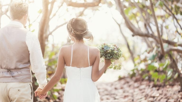 Shifts in temperature are leading to shifts in the wedding industry as bakers, photographers, florists and the couples they serve think about how to beat the heat on this all-important day. (JGI/Daniel Grill/Getty Images/Blend Images)