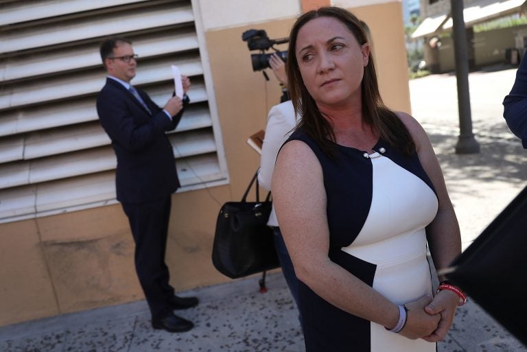 Lori Alhadeff and Ryan Petty, left, are seen in Fort Lauderdale, Fla., after turning in their paperwork to run for the Broward County School Board in May. Both parents had a 14-year-old daughter who was killed in the mass shooting at Marjory Stoneman Douglas High School in February. (Joe Raedle/Getty Images)