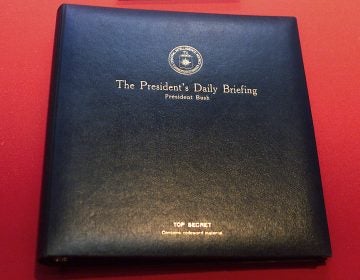 The President's Daily Briefing, or PDB, is the top-secret intelligence report the CIA presents to the president every weekday. The book shown here is for a briefing delivered to President George W. Bush in 2002.
(Damian Dovarganes/AP)