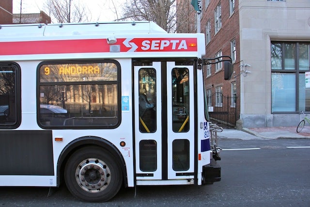 A SEPTA bus travels west on Walnut Street. Route 9 is the worst SEPTA bus route for time performance. (Emma Lee/WHYY)