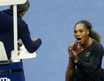 In this Saturday, Sept. 8, 2018, file photo, Serena Williams argues with the chair umpire during a match against Naomi Osaka, of Japan, during the women's finals of the U.S. Open tennis tournament at the USTA Billie Jean King National Tennis Center, in New York. Some black women say Serena Williams’ experience at the U.S. Open final resonates with them. They say they are often forced to watch their tone and words in the workplace in ways that men and other women are not. Otherwise, they say, they risk being branded an 