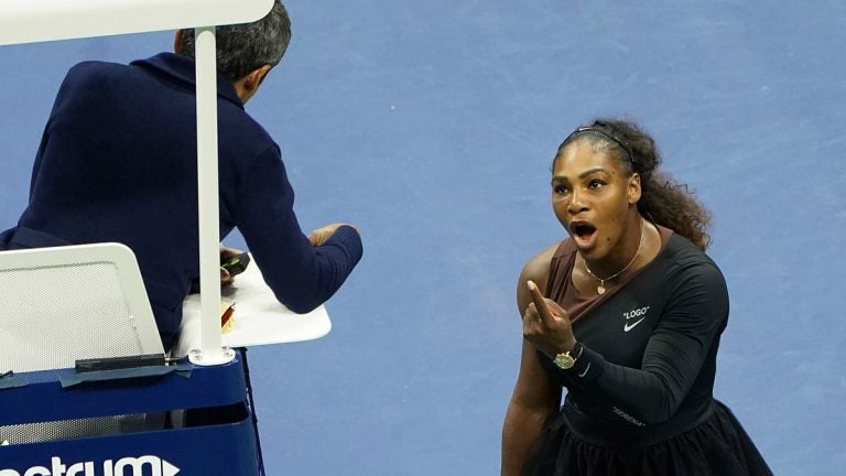 In this Saturday, Sept. 8, 2018, file photo, Serena Williams argues with the chair umpire during a match against Naomi Osaka, of Japan, during the women's finals of the U.S. Open tennis tournament at the USTA Billie Jean King National Tennis Center, in New York. Some black women say Serena Williams’ experience at the U.S. Open final resonates with them. They say they are often forced to watch their tone and words in the workplace in ways that men and other women are not. Otherwise, they say, they risk being branded an 