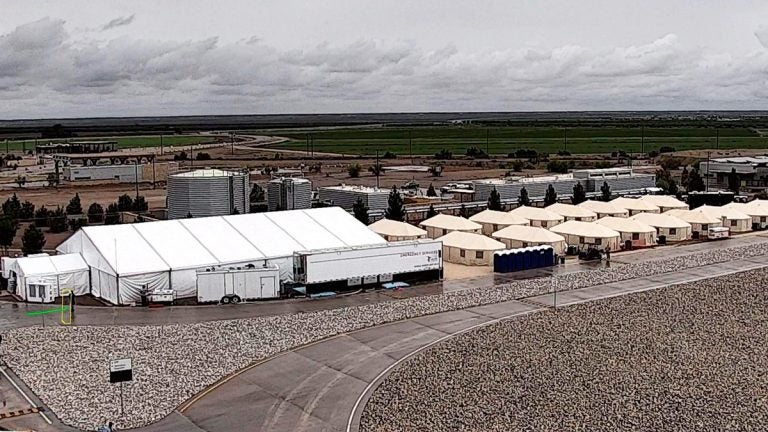 This undated file photo provided by HHS' Administration for Children and Families shows the shelter used to house unaccompanied foreign children in Tornillo, Texas. The U.S. government says the West Texas tent shelter will remain open through the end of the year. A spokesman for the U.S. Department of Health and Human Services said Tuesday, Sept. 11, 2018, that the facility will be expanded to 3,800 beds from its initial capacity of 360 beds. (HHS' Administration for Children and Families via AP, File)