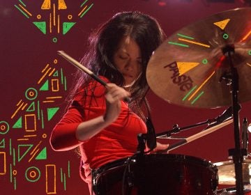 Meg White performs in Australia in 2003. (Photo Illustration: Bob King/Redferns and Angela Hsieh/NPR)